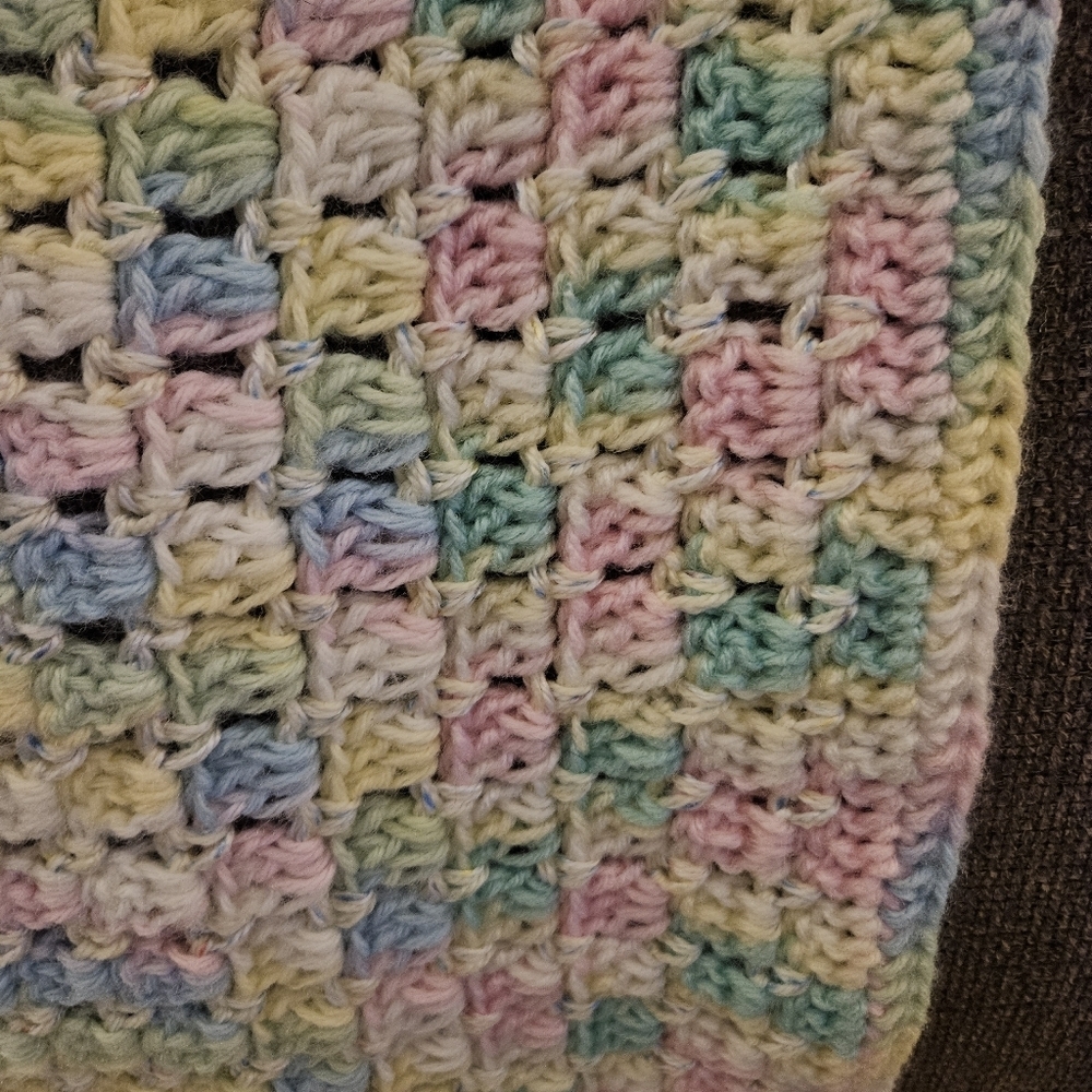Handmade crocheted baby blanket in beautiful pastels.  36x24